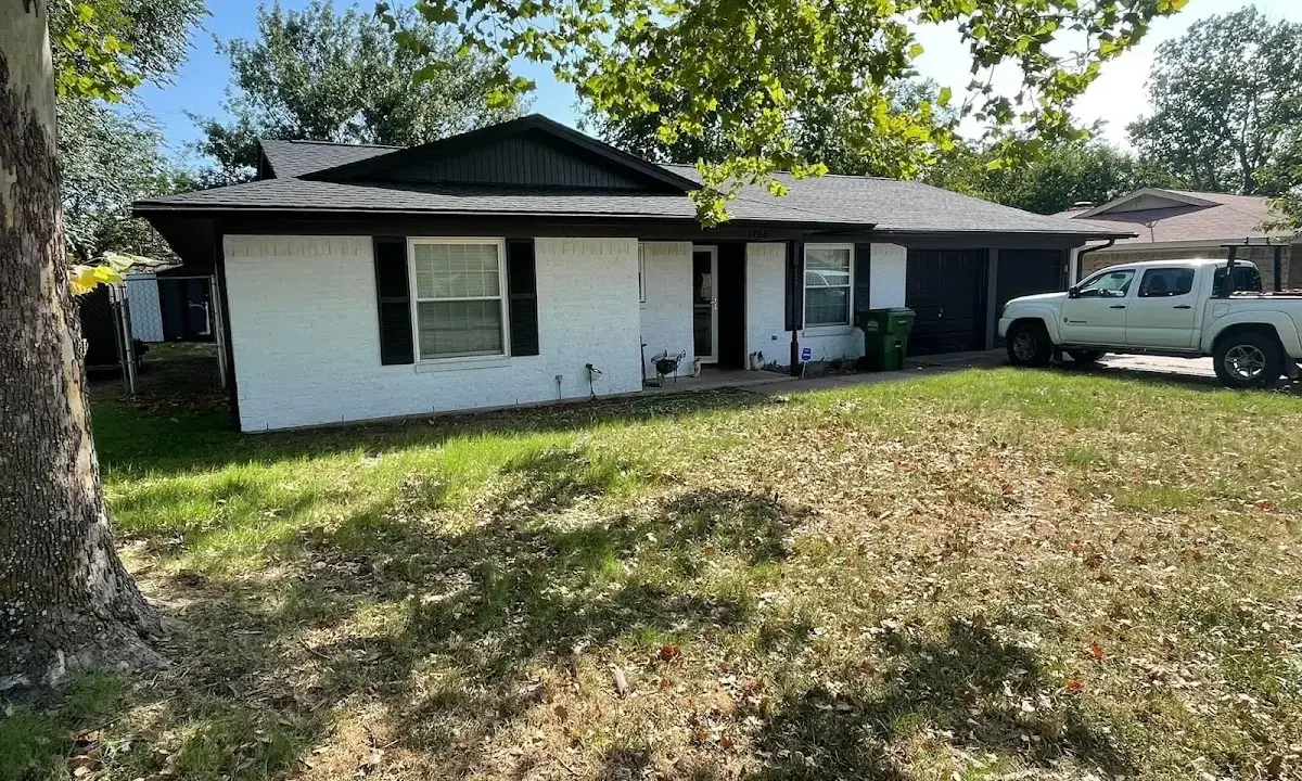 Professional roofing crew working on a residential roof in Gouverneur